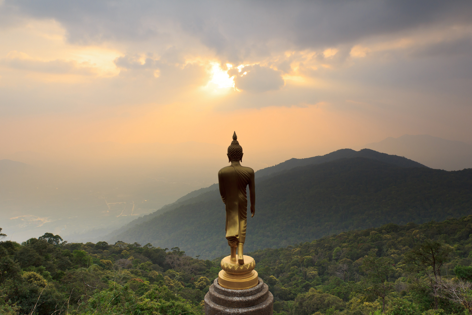 Landscape with mounts and Buddha statue,Thailand